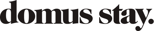 Text reading 'domus stay' in black font on a white background.