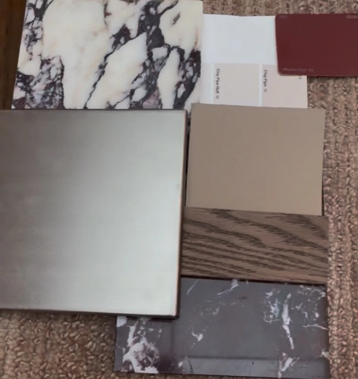 A variety of countertop and flooring samples, including marble, granite, wood, tile, and laminate swatches.
