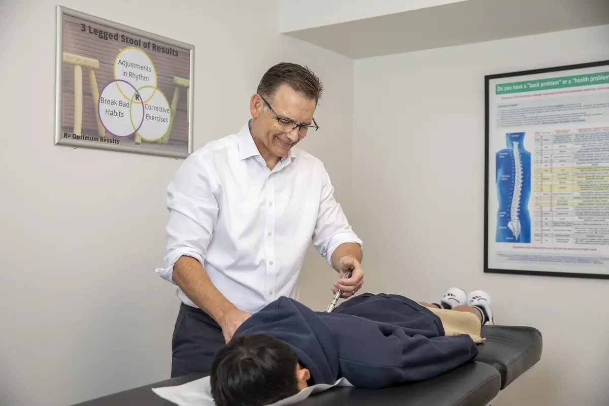 Chiropractic adjustment for back pain in Chatswood