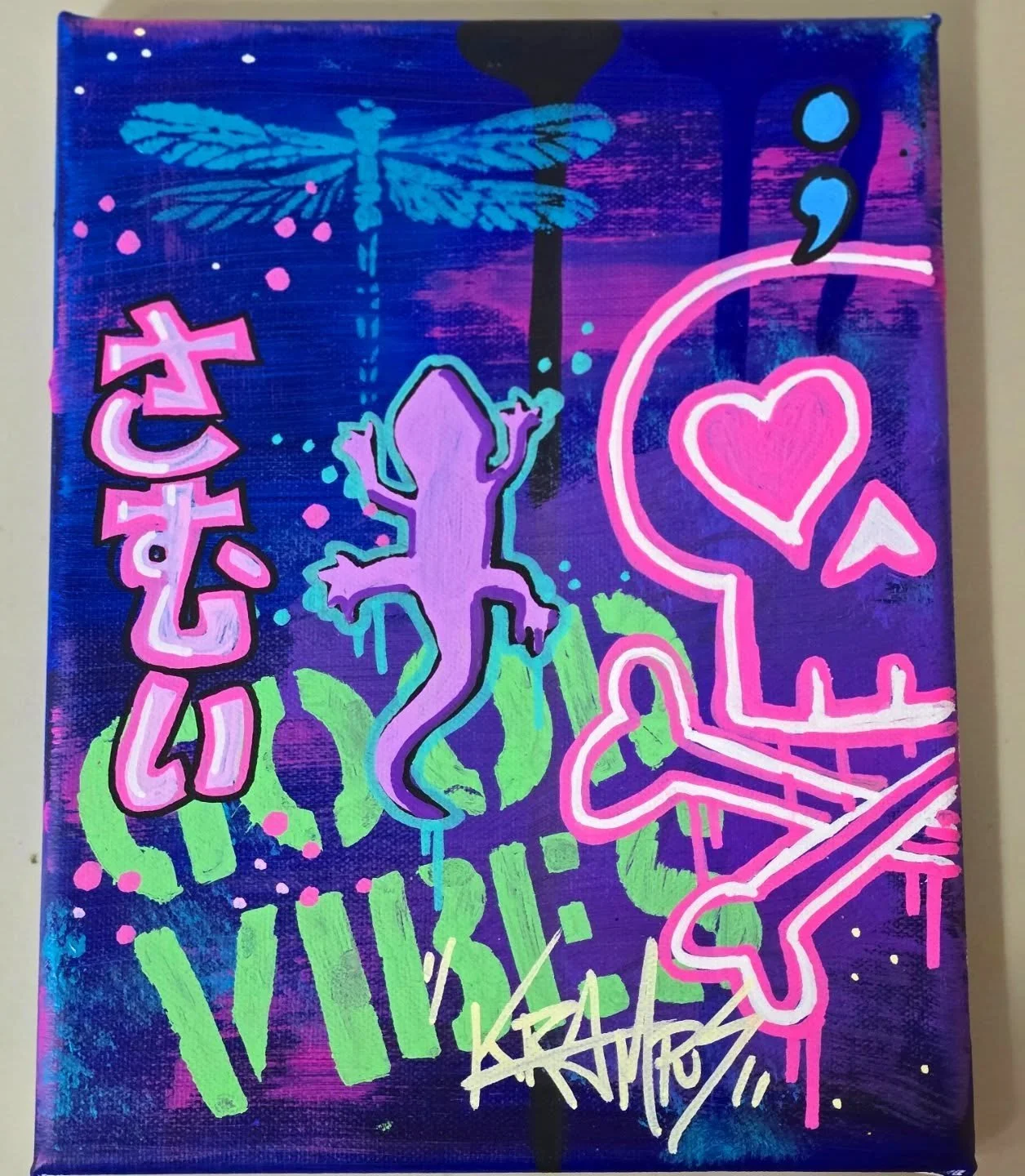 A colorful graffiti-style artwork featuring a neon dragonfly, a purple lizard, a pink heart, a neon pink star, and various abstract shapes and Japanese characters on a vibrant purple and blue background.