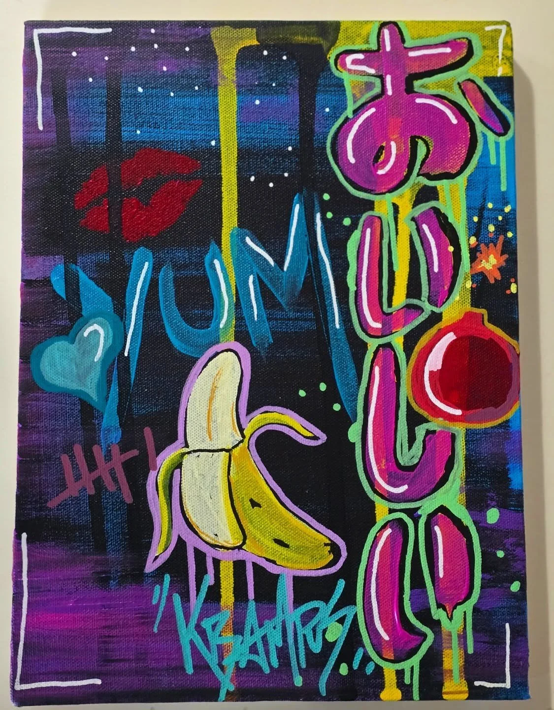 Colorful graffiti art featuring a banana, a heart, a moon, and the quote 'Live Your Dreams' with vibrant colors and spray paint-style effects.