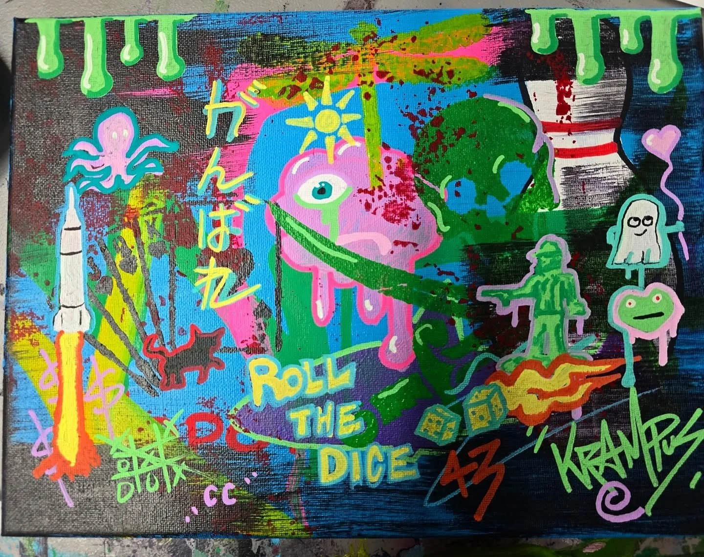 Bright, colorful graffiti-style artwork featuring cartoonish characters, a rocket, a cat, a ghost, an alien, and playful text including 'Roll the Dice,' with splashes of paint, Japanese characters, and various abstract elements.