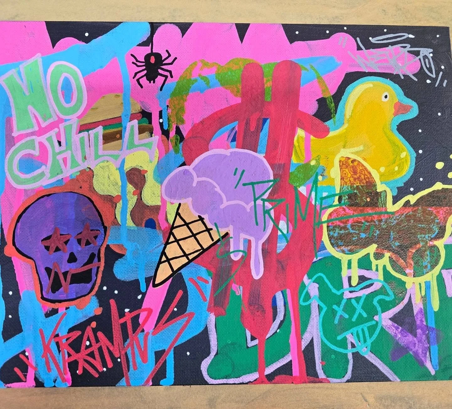 Colorful street art mural featuring a purple skull with star-shaped eyes, an ice cream cone, a yellow duck with an ice cream cone, a green shape with outlines, and various graffiti tags and phrases including "NO CHILD" and "KEND" against a black back