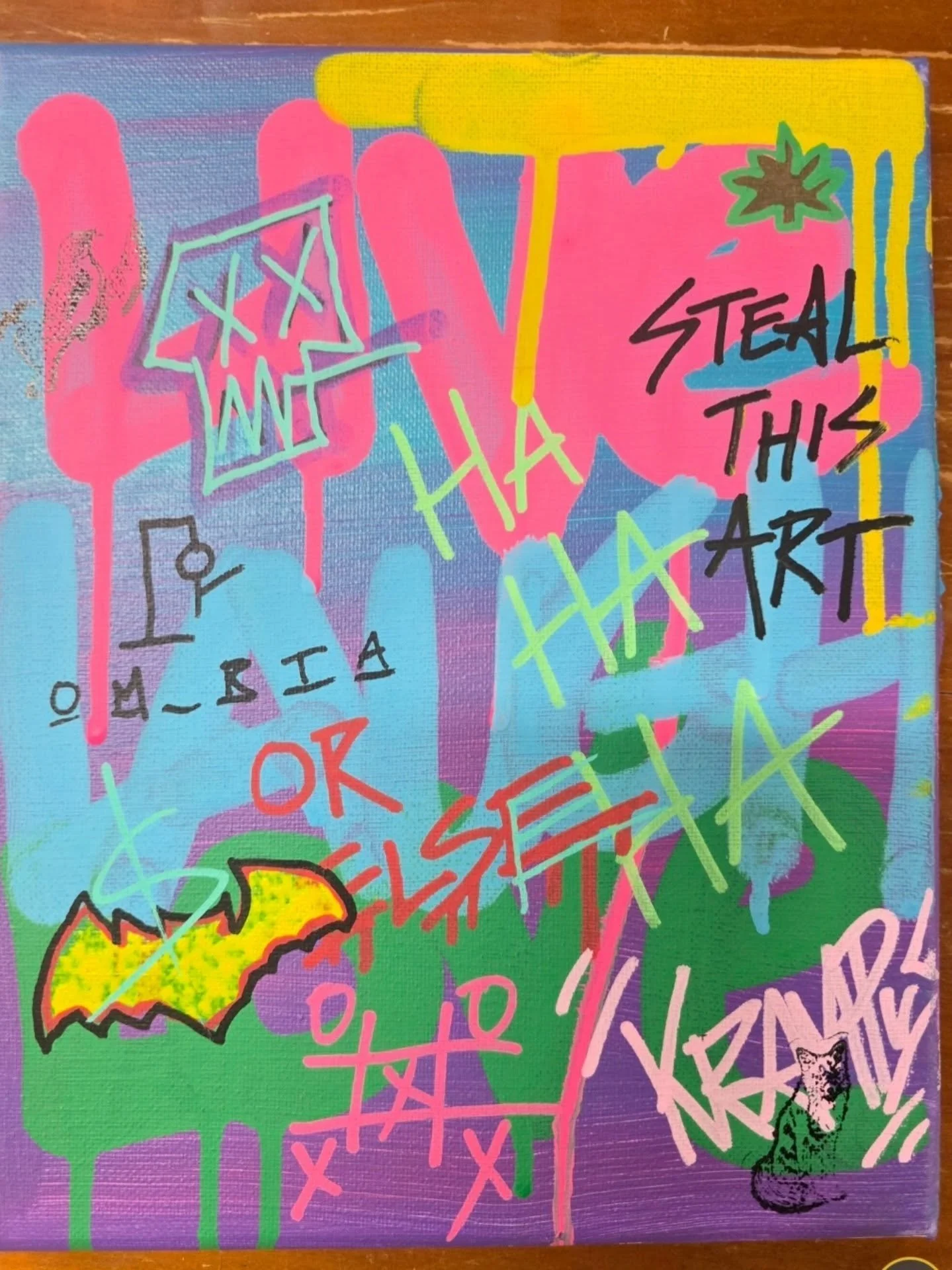 Colorful graffiti-style artwork with phrases like "STEAL THIS ART," and "HAG," along with various abstract shapes, scribbles, and a black and yellow flame design.