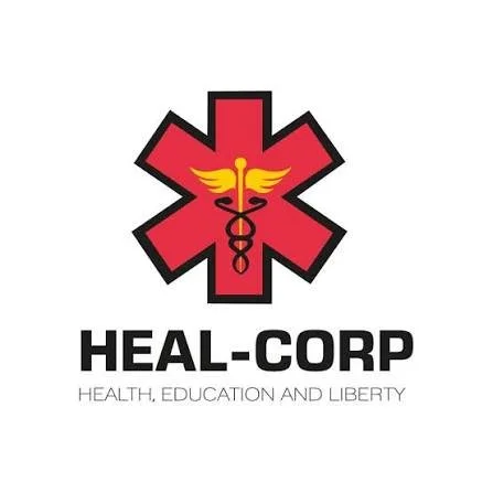 Heal-Corp logo featuring a red medical star of life with a yellow caduceus and this text: 'HEAL-CORP' and 'Health, Education, and Liberty'.