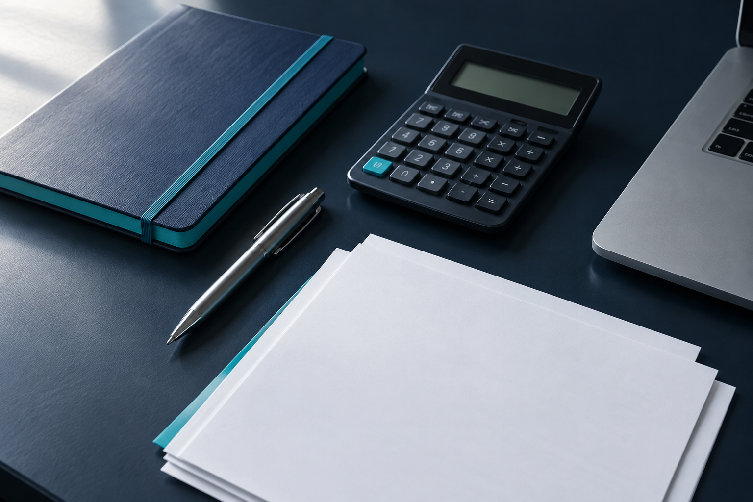 Illustrative financial review workspace with a navy notebook, calculator, silver pen, and neatly arranged papers.