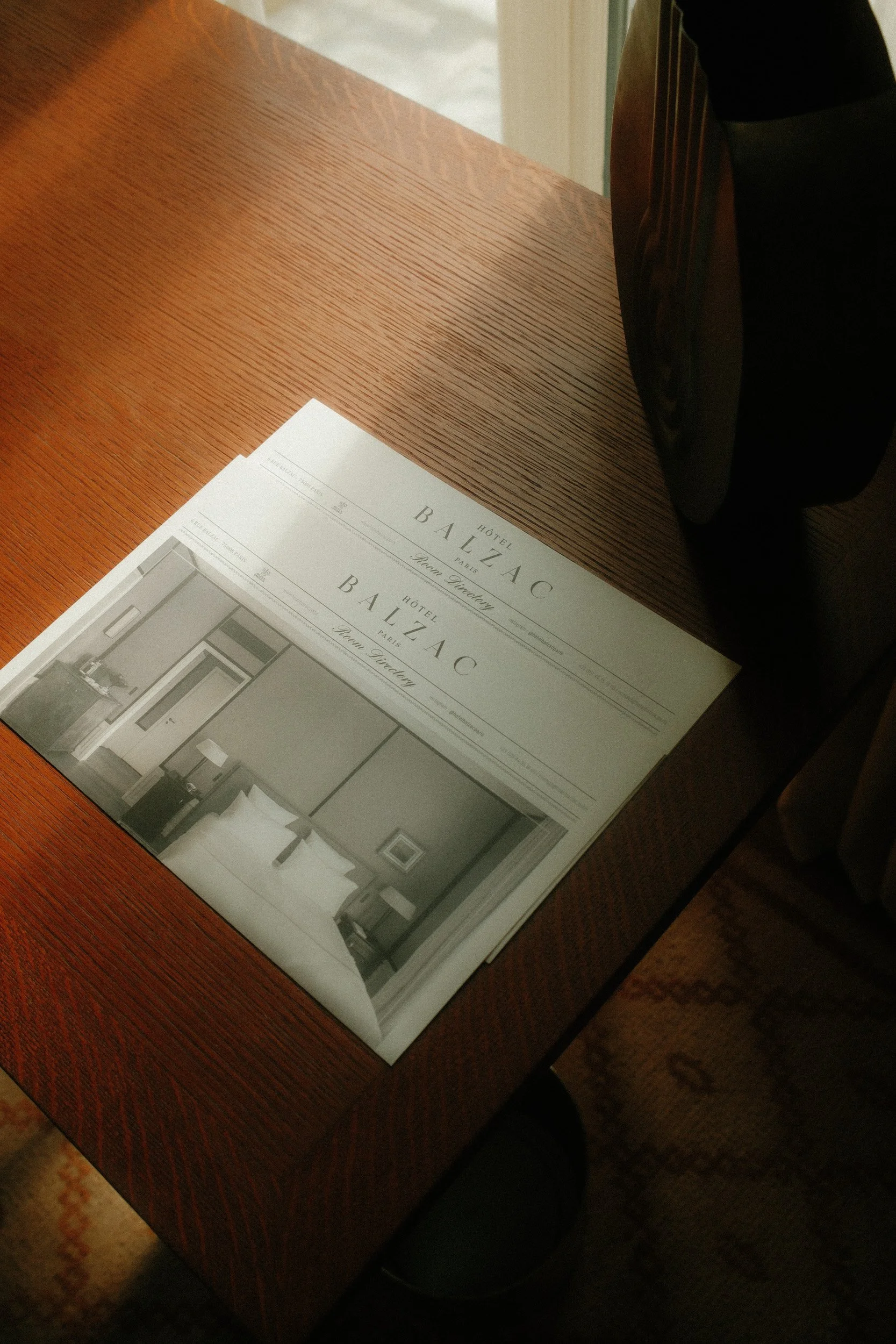 A pamphlet from the Hotel Balzac in Paris featuring an interior room design.