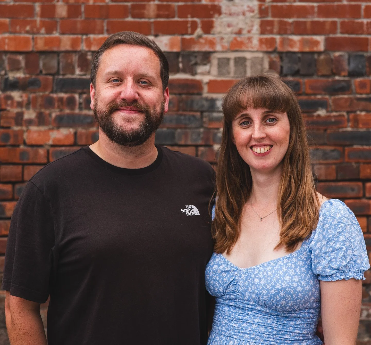 Phil and Sarah smiling at camera.