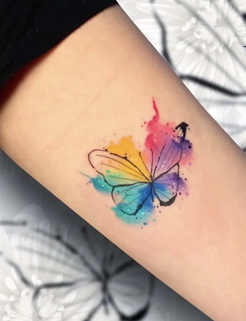 tattoo disney watercolor mariposa realizado en Purezas Tattoo Gandía