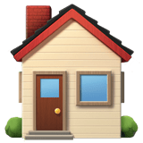 A small beige house with a red roof, a brown door with a glass window, and a large blue window, surrounded by green bushes.