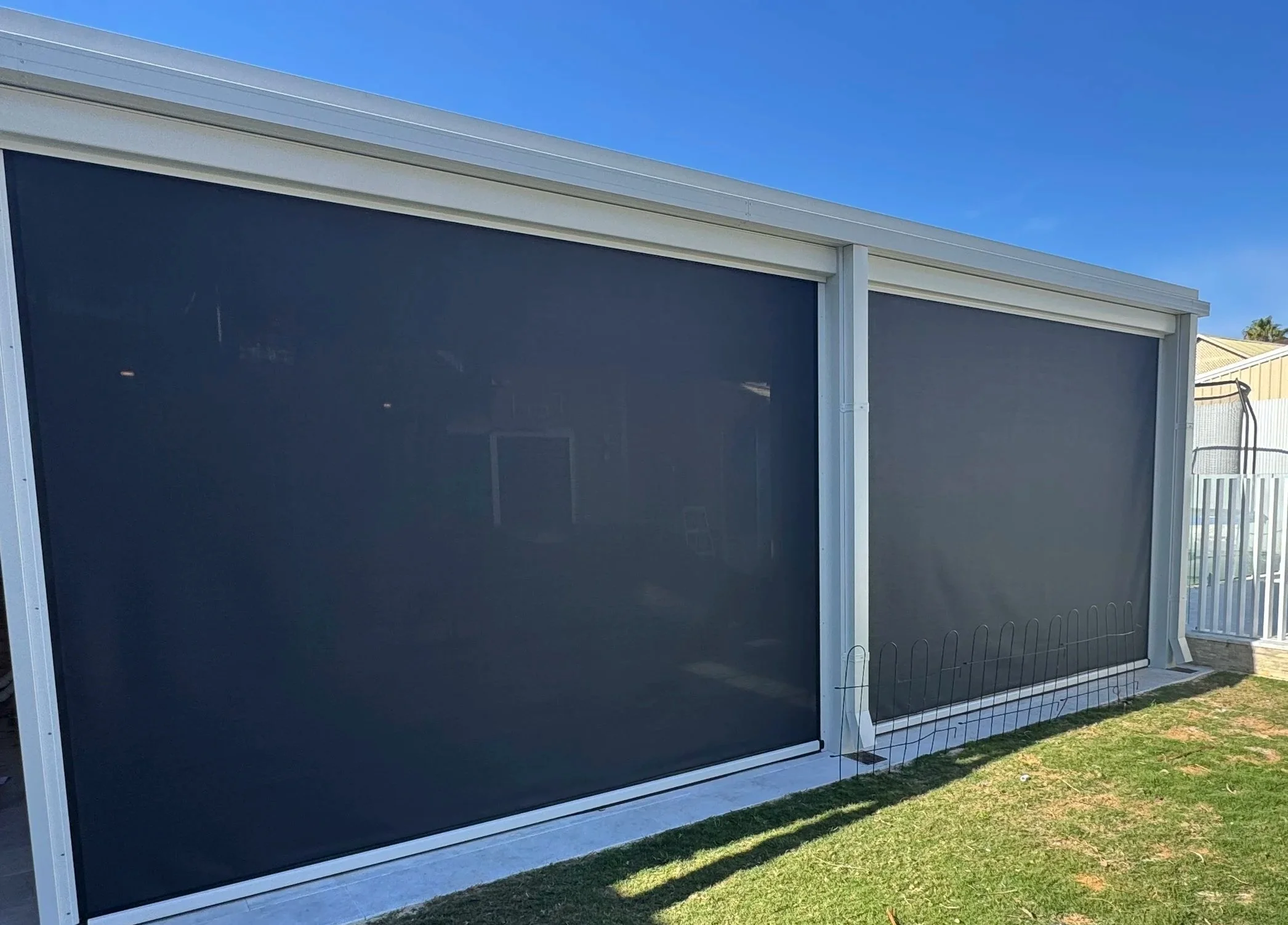 ziptrack outdoor blinds enclosing a patio