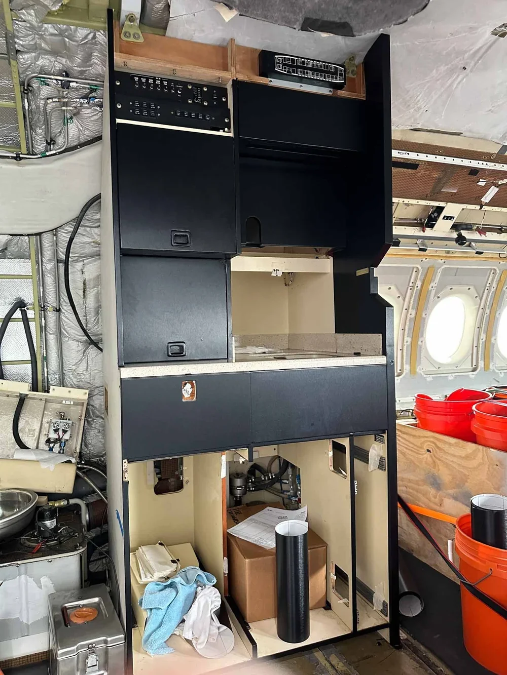 Falcon 900B galley cabinetry after wrapped 3m di-noc me-1685