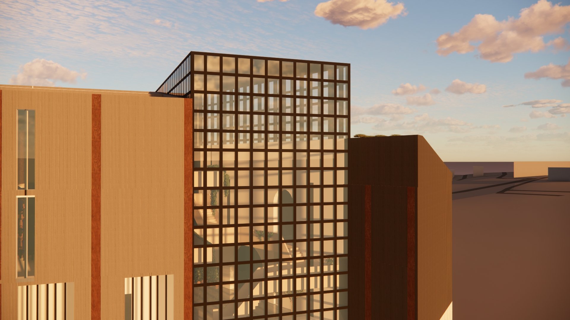 A modern architectural building with a wooden facade and a glass grid extension under a partly cloudy sky at sunset.