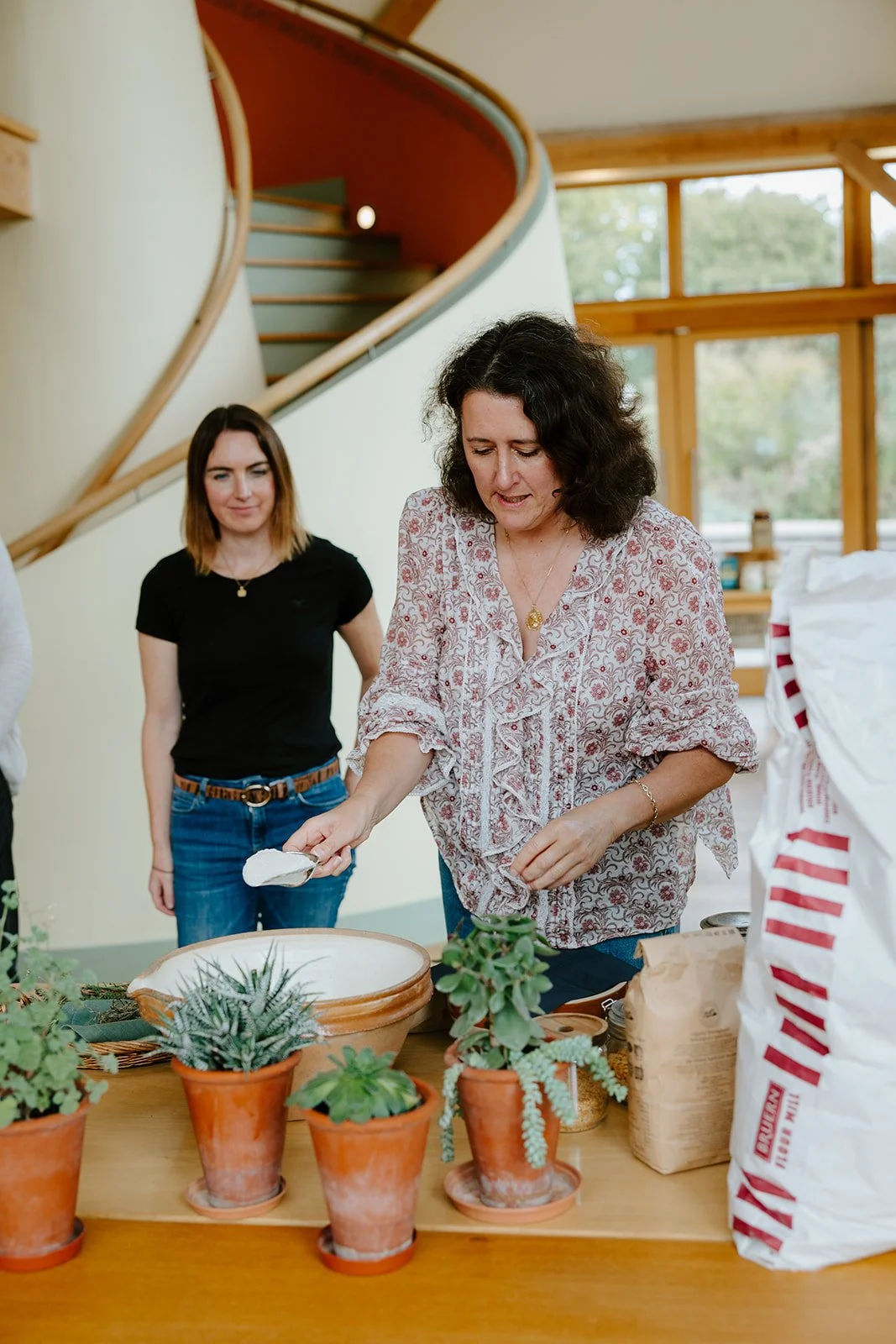 Joanna Issa demonstrating how to blend flours to make bread