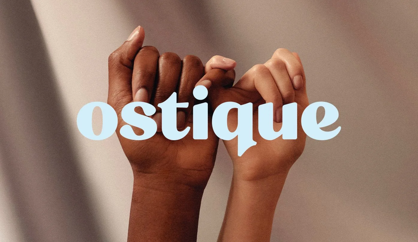Two hands, one dark-skinned and one light-skinned, clasped together with the word 'oseigue' in light blue text overlaid on the image.
