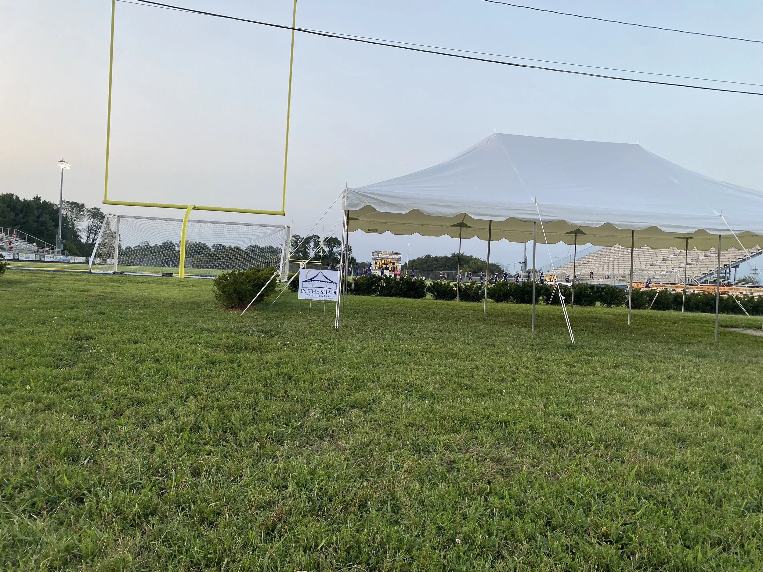 large 20x30 pole tent at a football field in Frankfort, Kentucky
