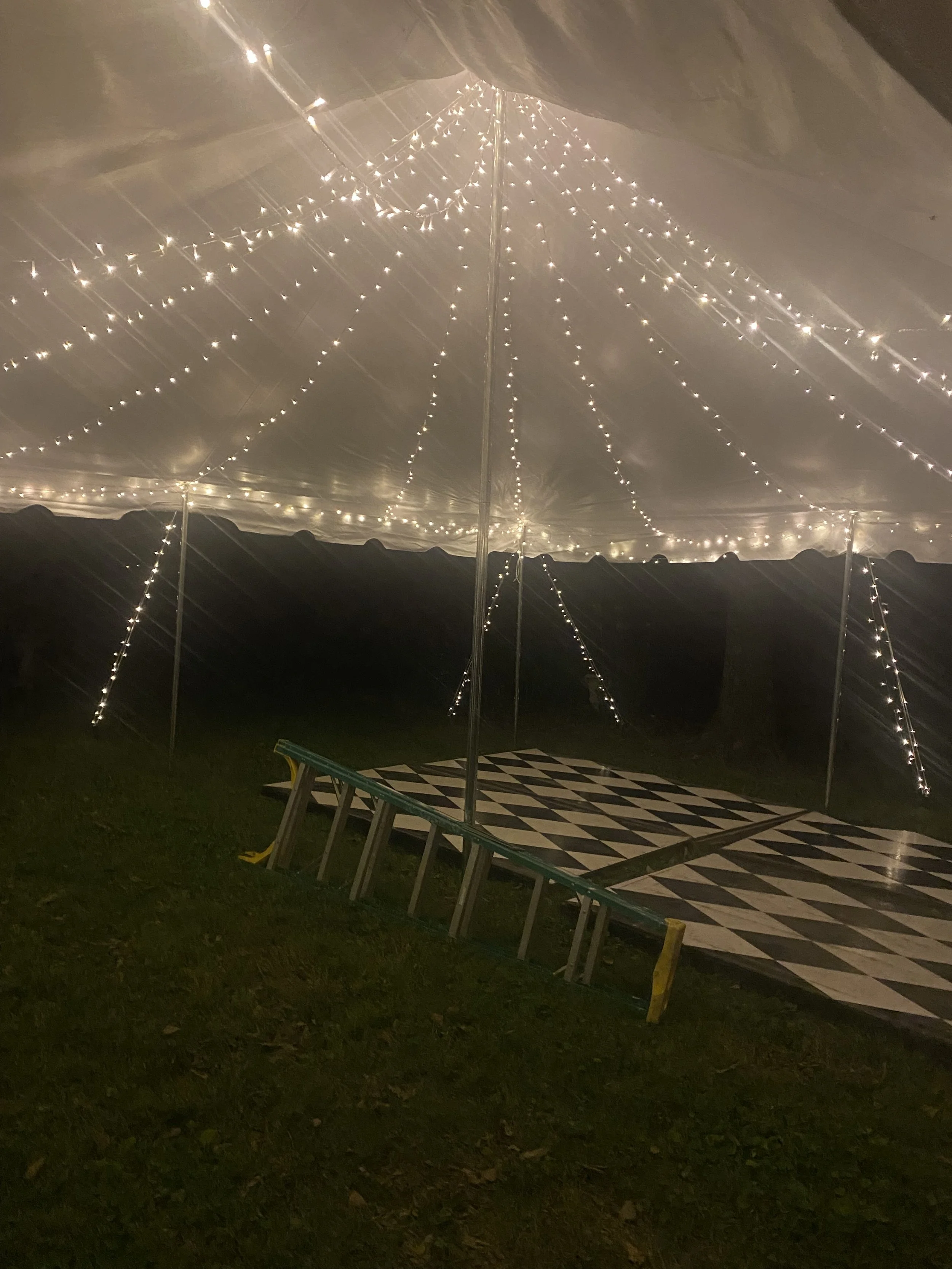 underneath a 20x20 tent with string lighting in Frankfort, Kentucky