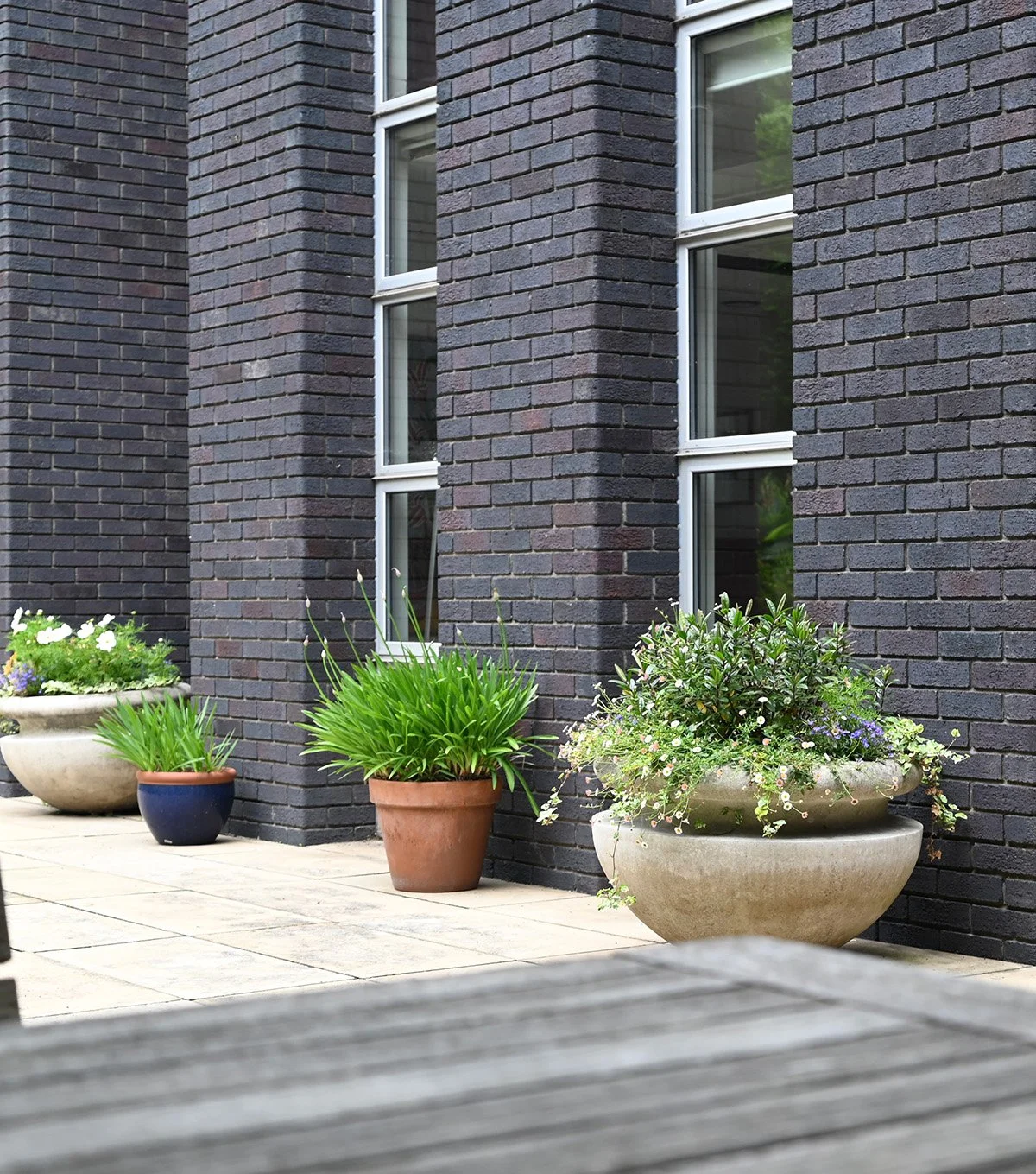 architectural-planters-dark-brick-building.jpg