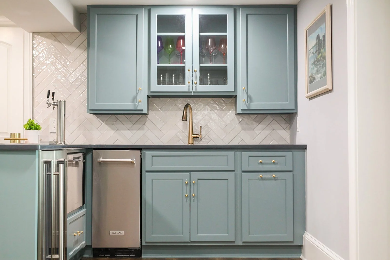 A basement renovation and remodel with a small kitchen and custom blue cabinets. In Greenville, South Carolina. 