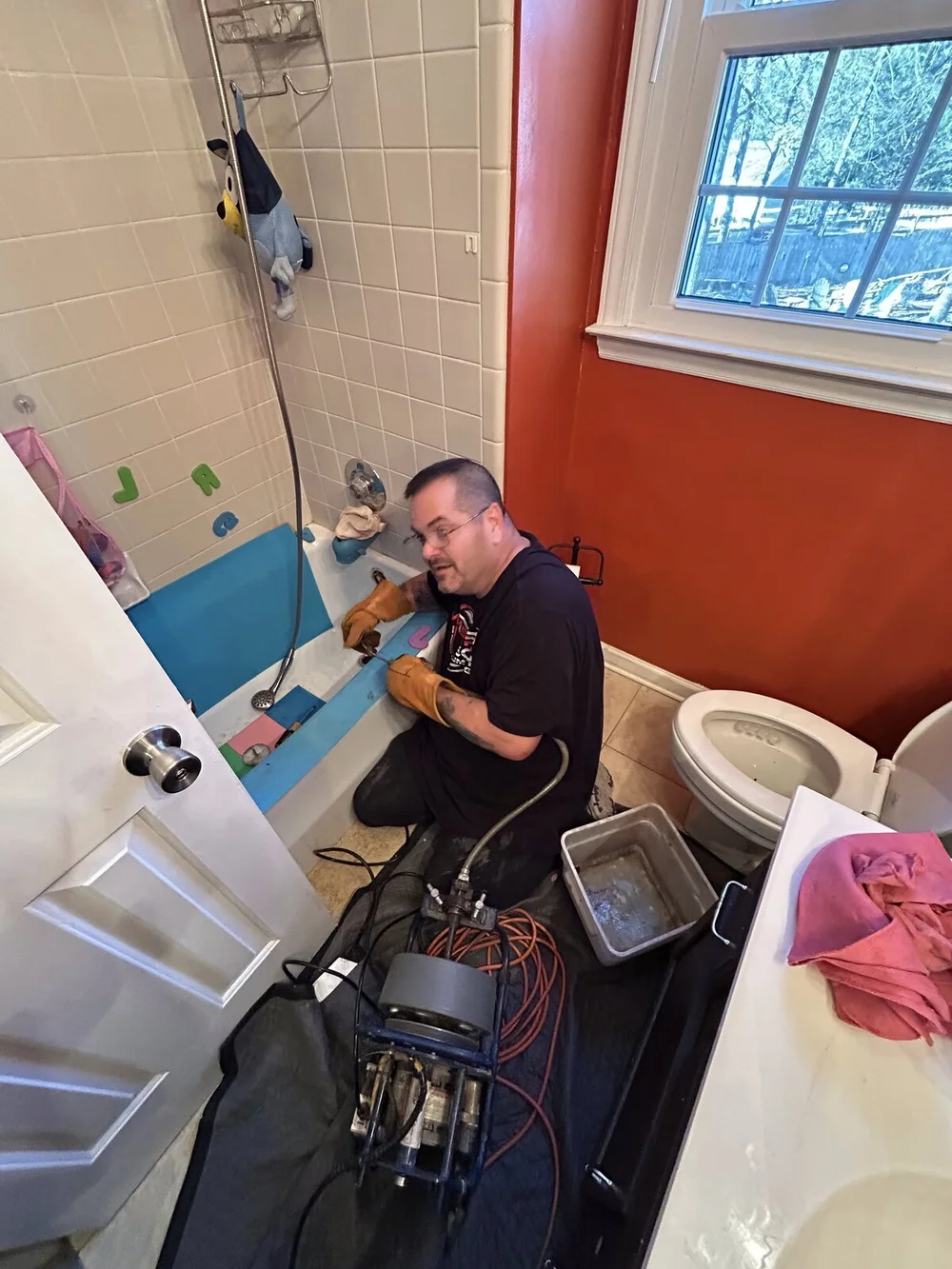 Drain snaking service in a bathroom