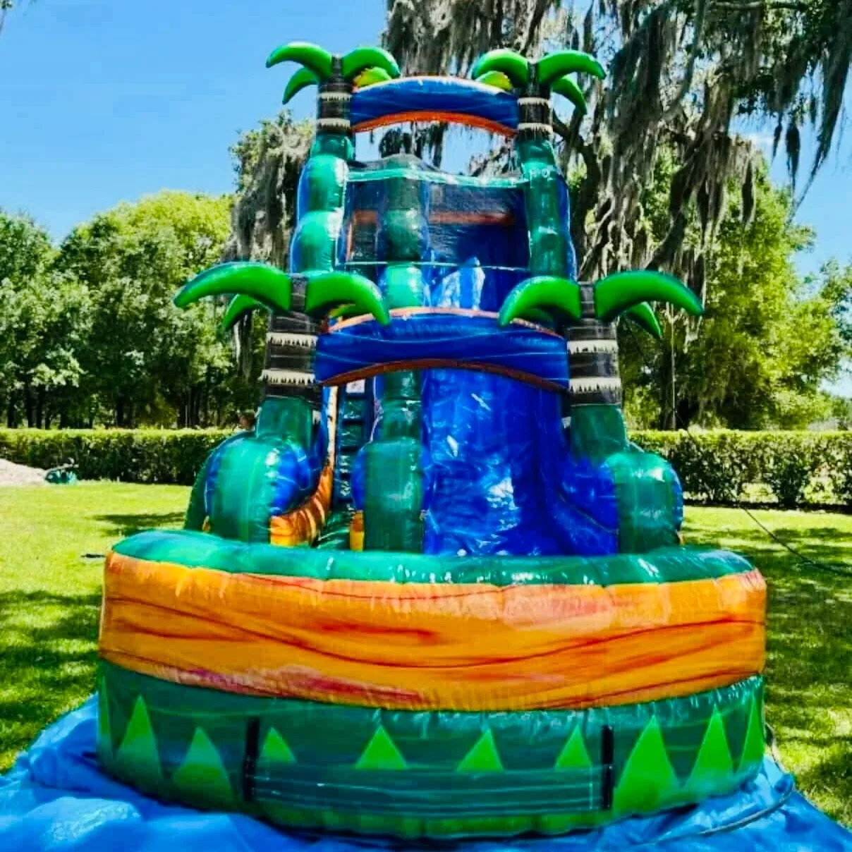 Swamp King 22-ft water slide rental in Brunswick GA, featuring a tall, fast slide and splash pool for backyard parties
