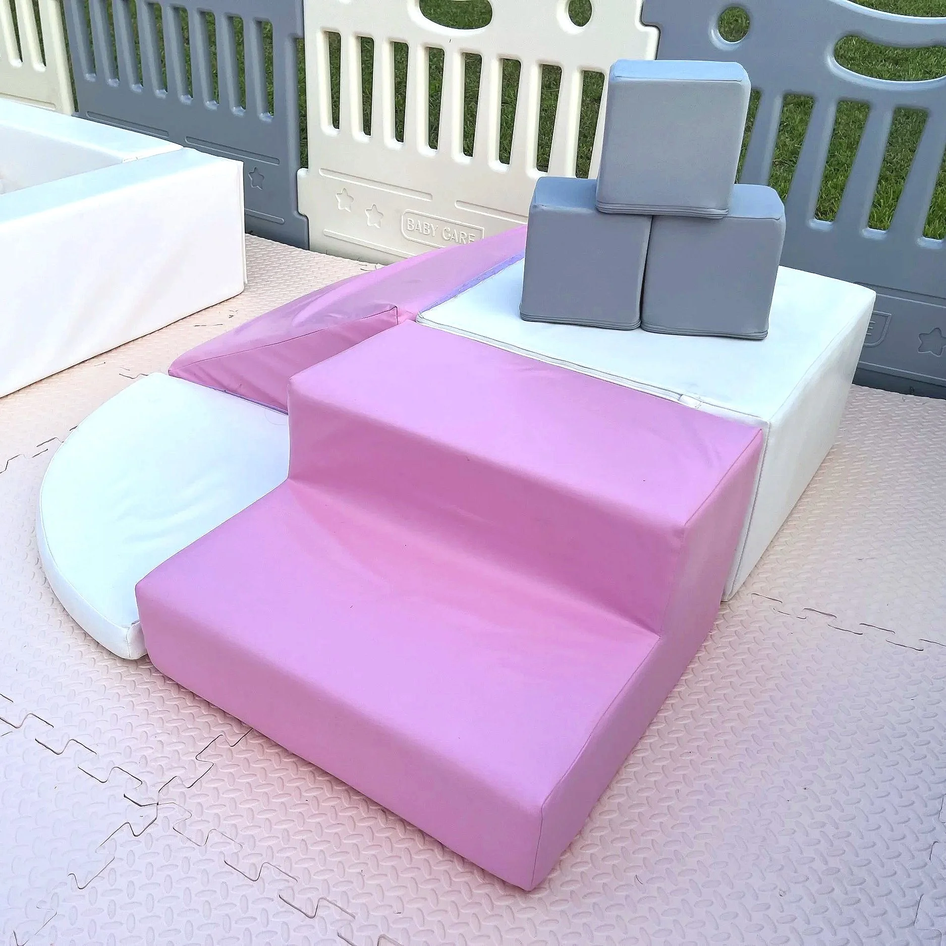 luxury soft play featuring a white bounce house, inflatable ball pit, white slide, foam blocks, and toddler play equipment in Jefferson County, West Virginia.