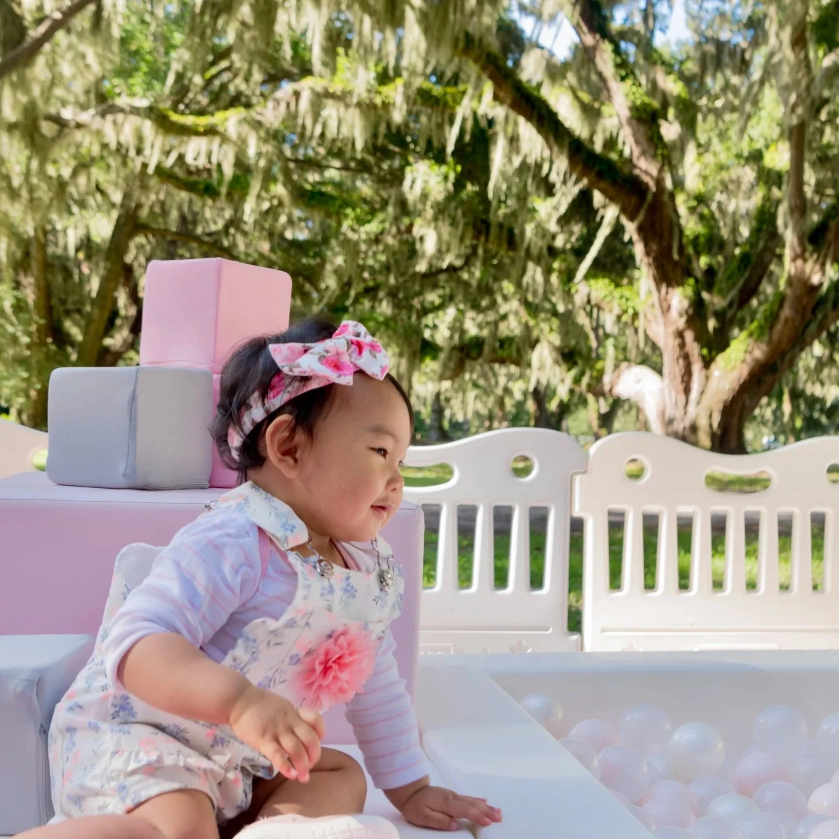 luxury soft play featuring a white bounce house, inflatable ball pit, white slide, foam blocks, and toddler play equipment in Jefferson County, West Virginia.