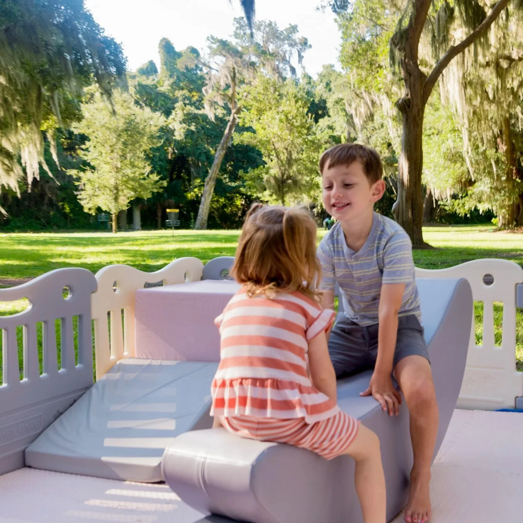 luxury soft play featuring a white bounce house, inflatable ball pit, white slide, foam blocks, and toddler play equipment in Jefferson County, West Virginia.