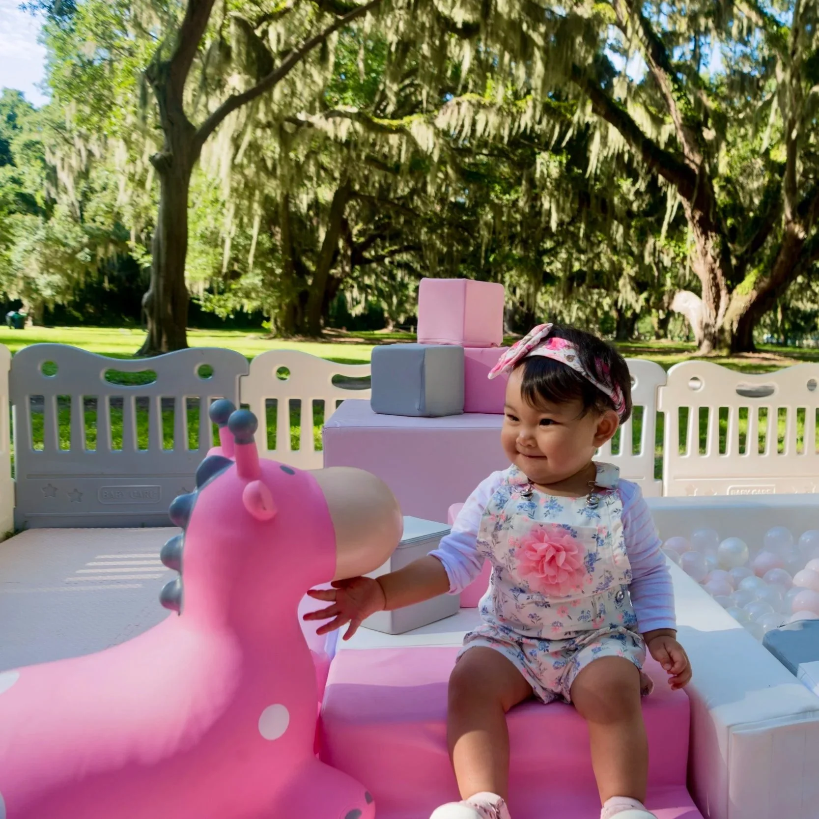 luxury soft play featuring a white bounce house, inflatable ball pit, white slide, foam blocks, and toddler play equipment in Jefferson County, West Virginia.