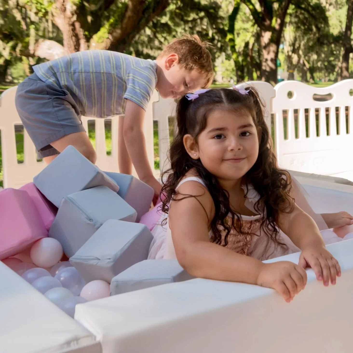luxury soft play featuring a white bounce house, inflatable ball pit, white slide, foam blocks, and toddler play equipment in Jefferson County, West Virginia.