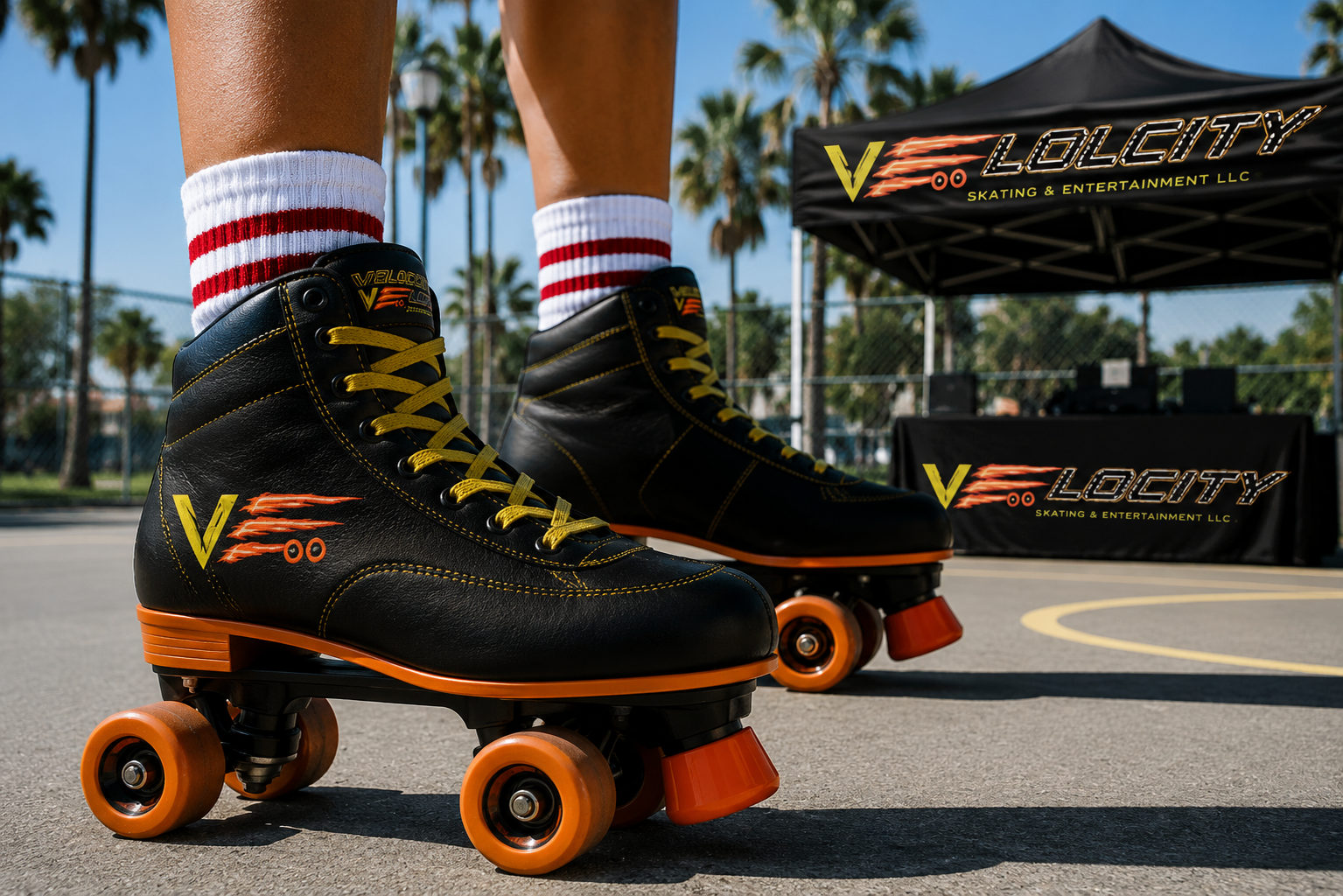 Close-up of a person wearing black roller skates with yellow laces, red wheels, and a logo reading 'VLOG CITY' on the side, standing on an outdoor tennis court with palm trees and a black tent with the same logo in the background.