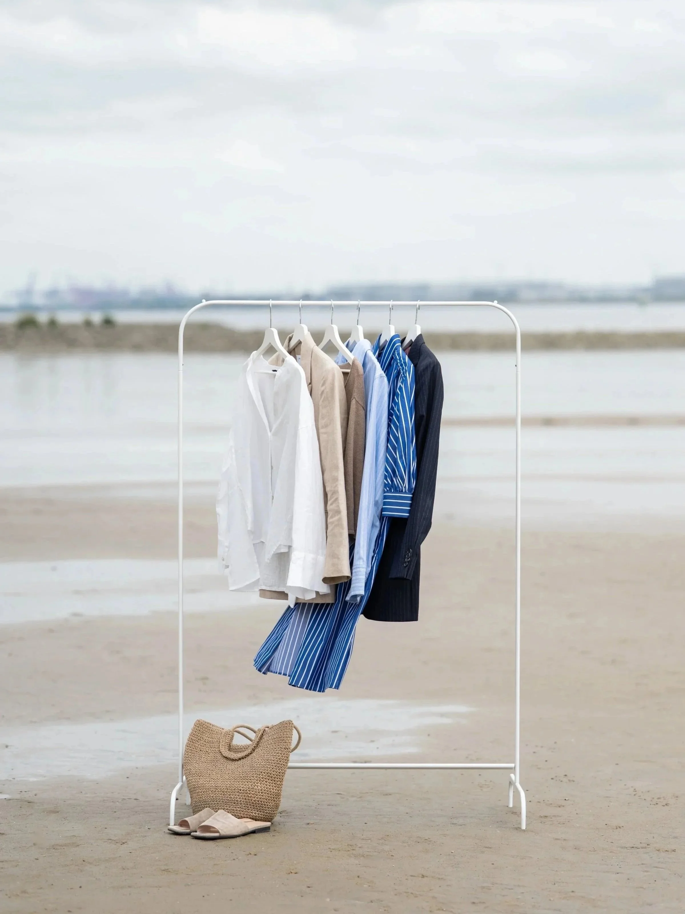 clothing rail by the beach high end textile  fashion accessoiries