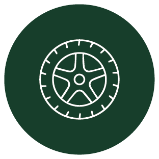 Close-up of a tire with a green background.