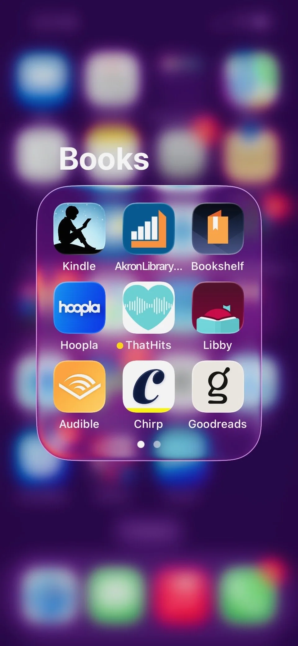Screenshot of a smartphone folder titled 'Books' containing app icons for Kindle, AkronLibrary, Bookshelf, Hoopla, ThatHits, Libby, Audible, Chirp, and Goodreads.