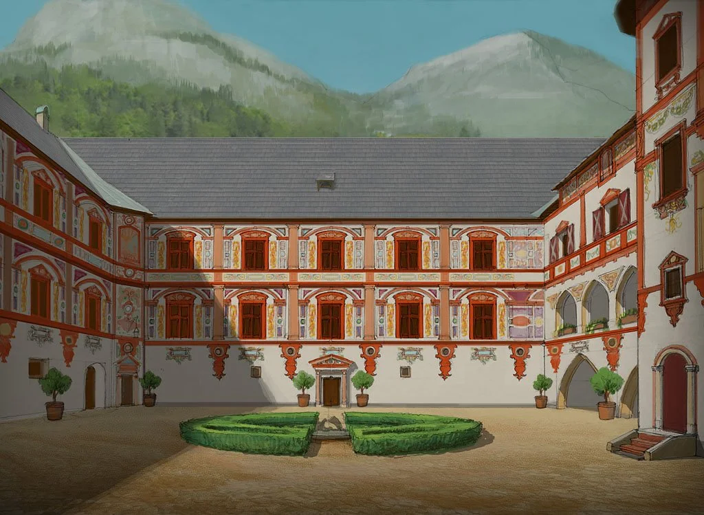A large, historic European courtyard with ornate, colorful building facades, potted trees, trimmed hedges, and mountains in the background.