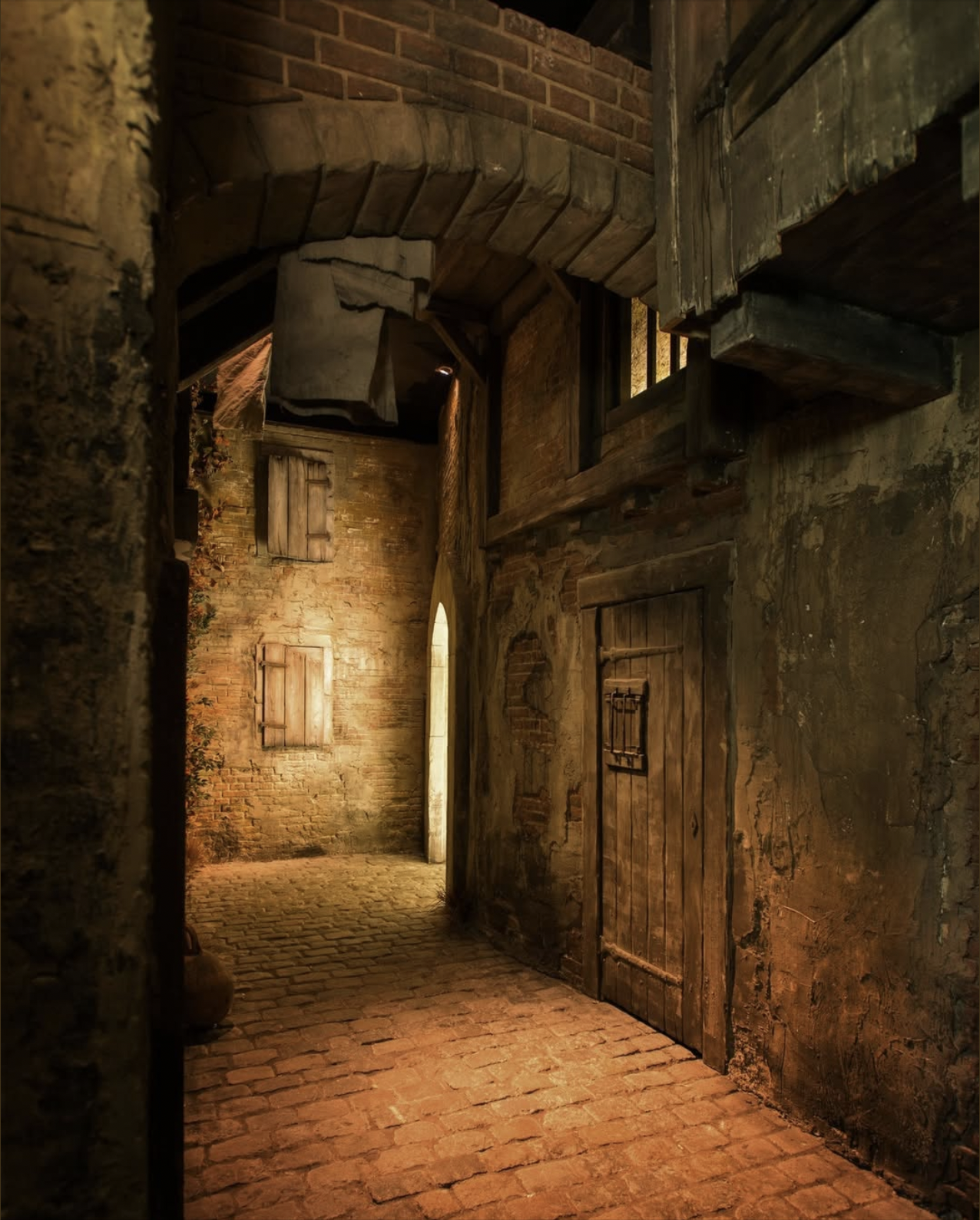 A narrow alleyway with brick walls, wooden doors, and small windows, illuminated by warm lighting, creating an old rustic atmosphere.