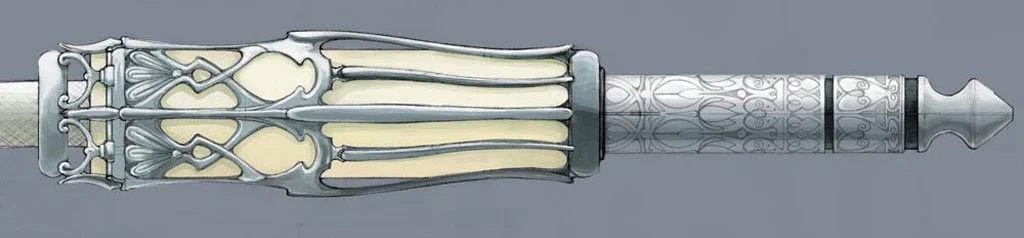 Detailed view of a decorative, ornate dagger with a silver and ivory handle and a complex, patterned blade.