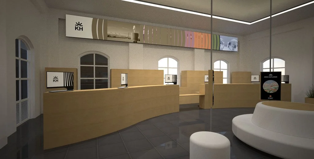 An interior reception area with wooden desks, computer monitors, and large windows. There is a curved white seating area and a sign that says 'Area Explorer Start'.