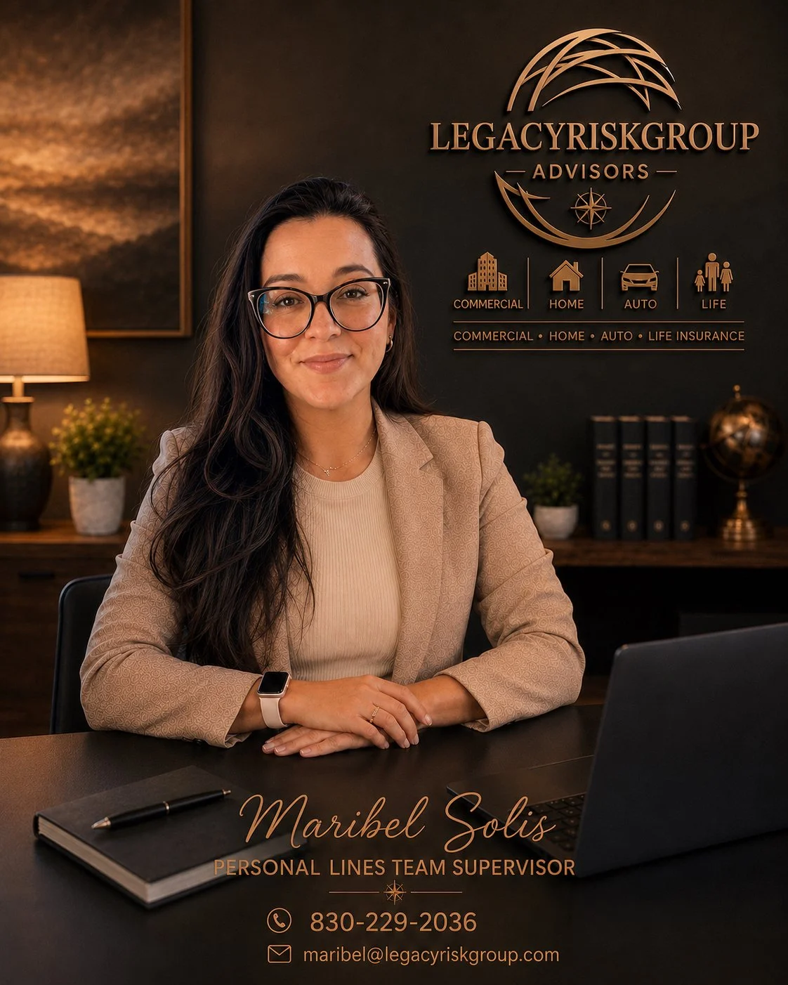 Professional woman sitting at a desk with a laptop, business card, and pen, in an office with a dark wall and gold signage displaying "Legacy Risk Group Advisors" and icons for commercial, home, auto, and life insurance.