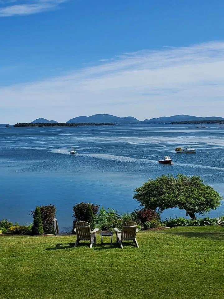View from the porch of Frenchmans' Bay with Bar Harbor and Cadillac Mountain in the distance.