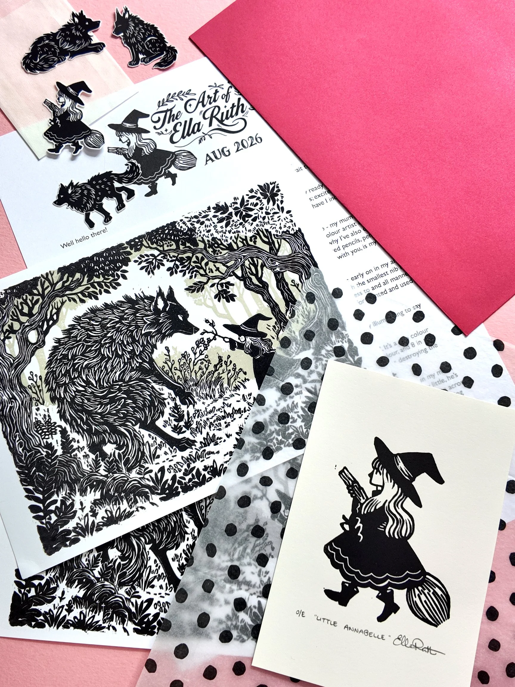 Black and white illustrations and stickers featuring a witch riding a broomstick, wolves, and a girl in a witch costume with a broom, on various papers and cards, with some pink and polka dot backgrounds.