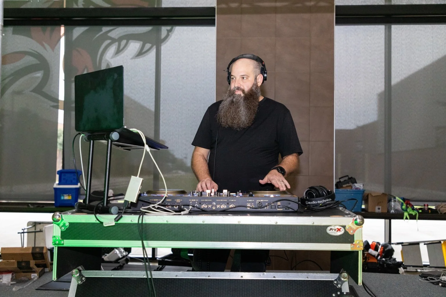 Social Sound Co. DJ performing behind a professional DJ setup in Dallas-Fort Worth.