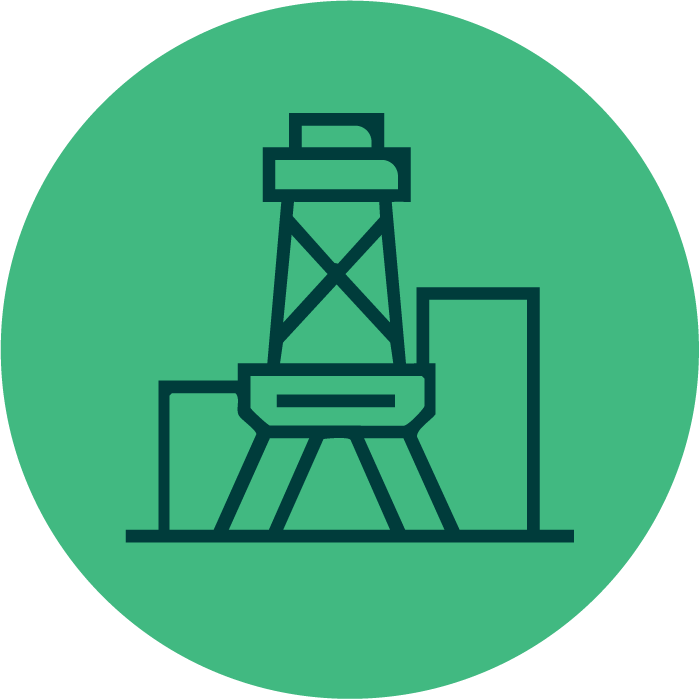 Icon of an oil drilling rig with surrounding buildings on a green circular background.