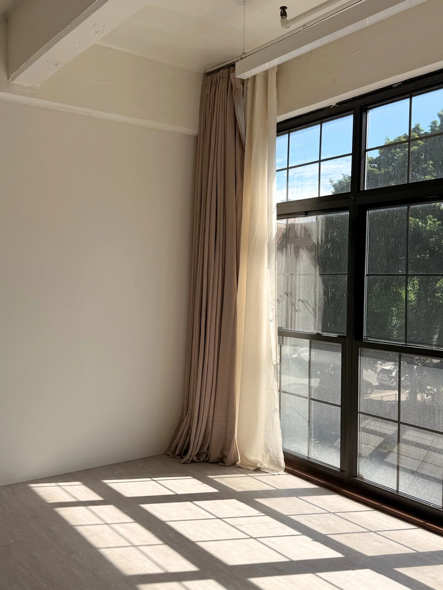 Industrial black factory windows inside Little Light Studio