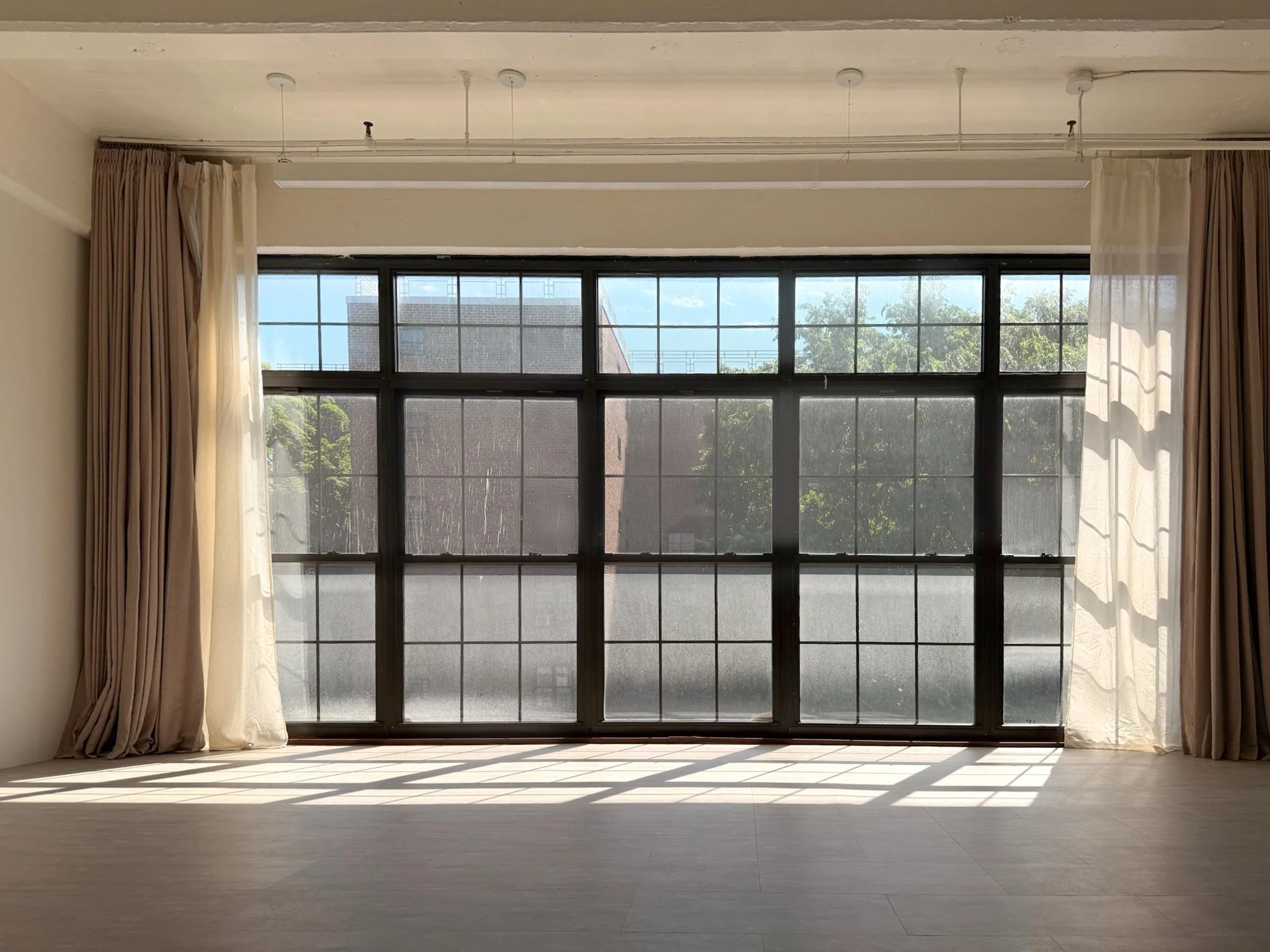 Industrial black factory windows inside Little Light Studio