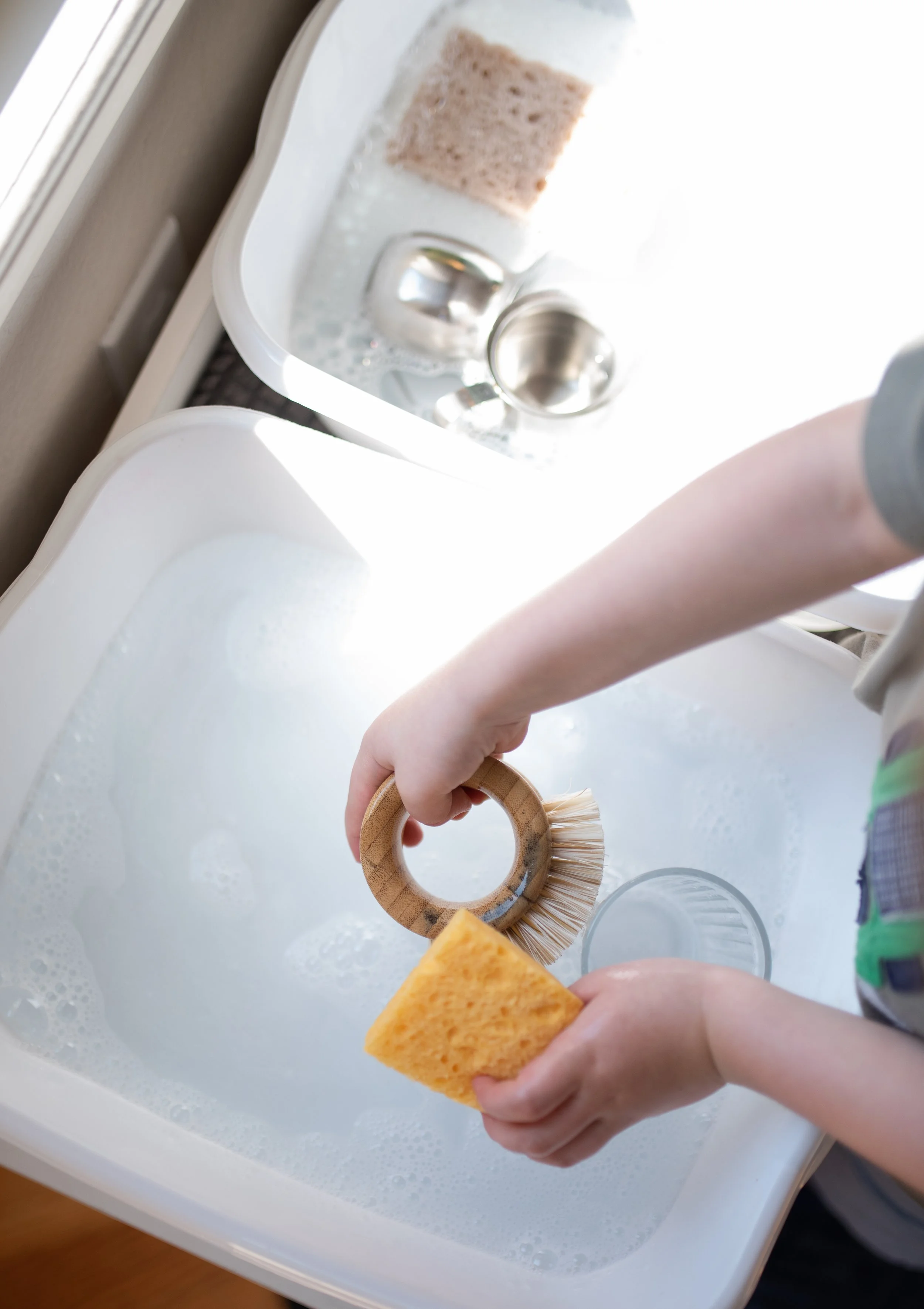 child washing a toy