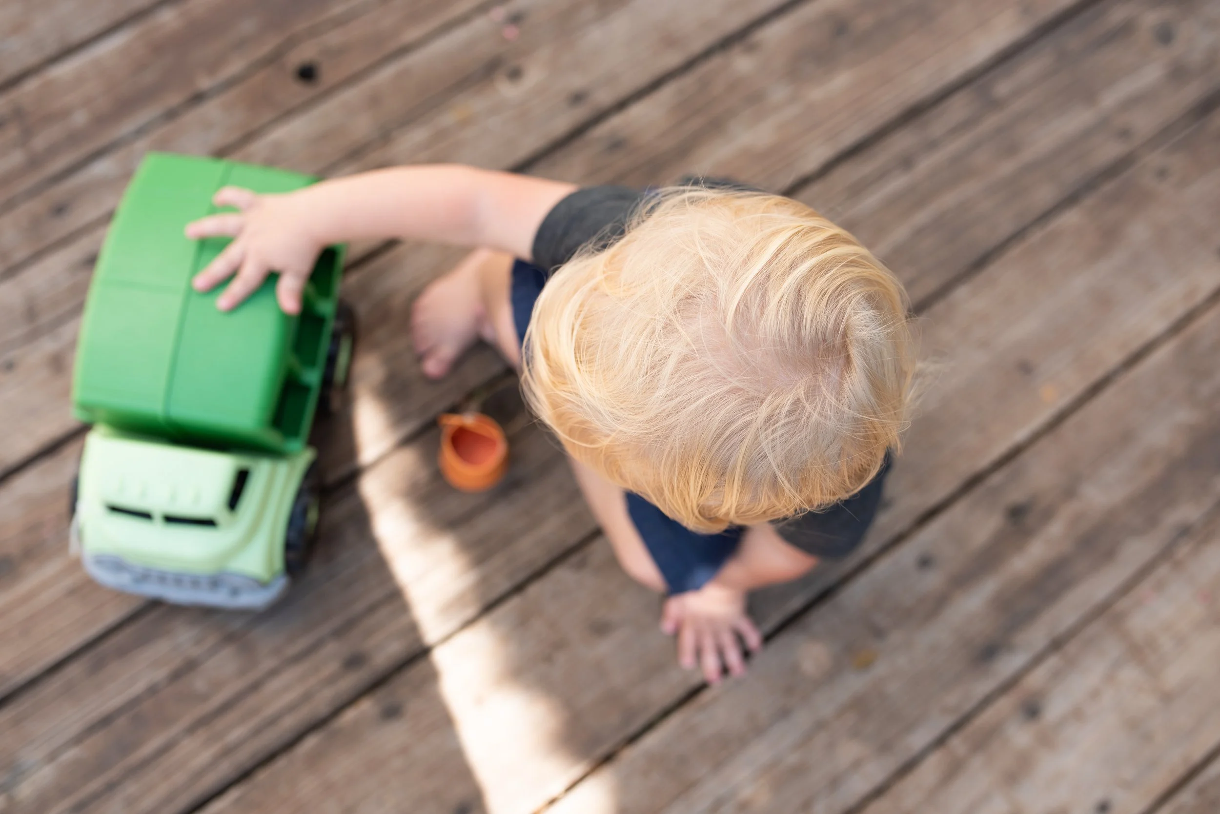 boy playing with a truck