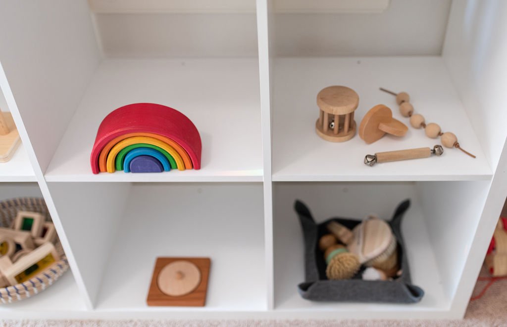 montessori toys on a white shelf