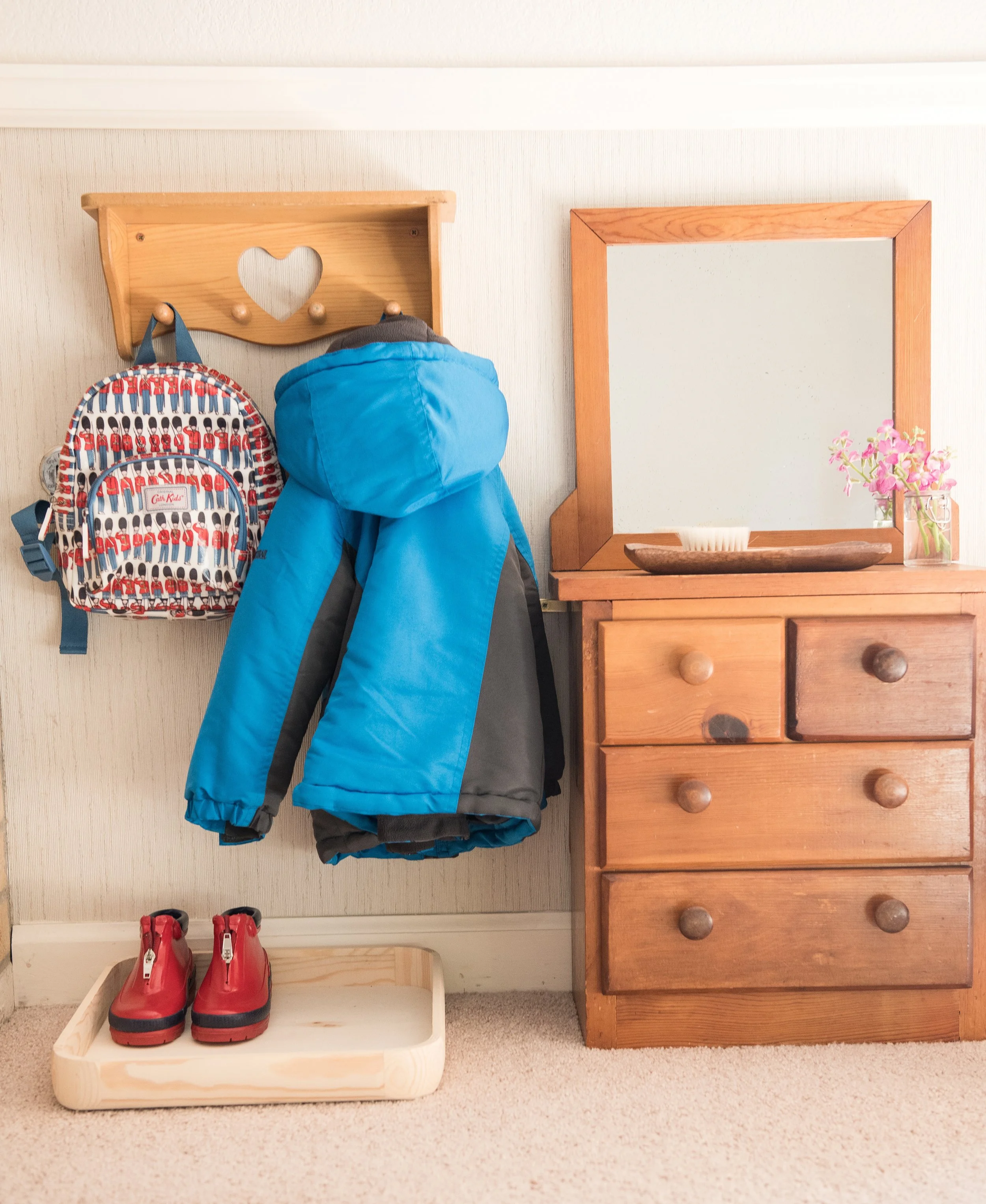 coat and backpack on hooks