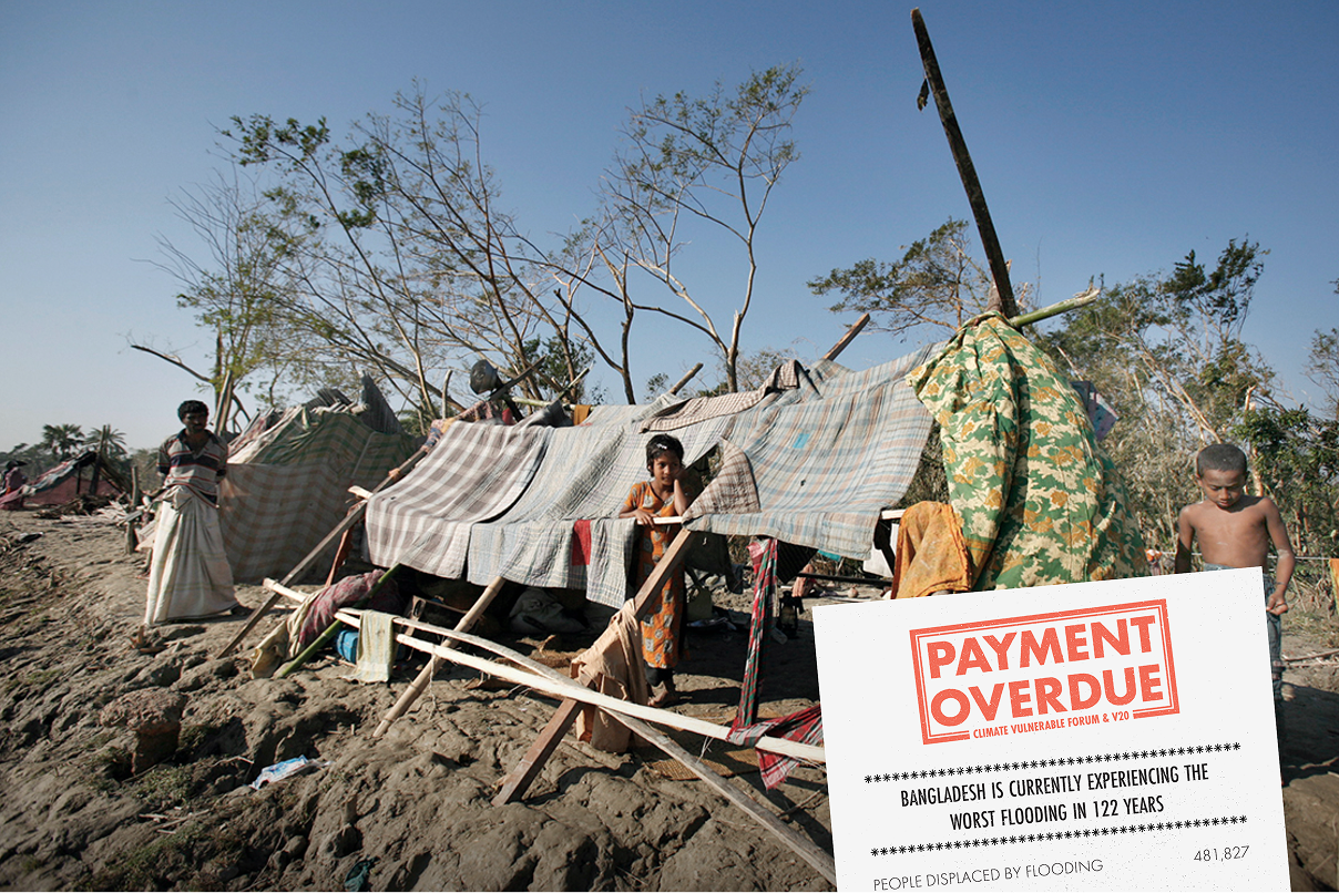 A group of people are stood around a house made of logs and fabric coverings. The land around them looks damaged by rain and heat. The photo has a receipt over the top of it that reads 'Payment overdue'